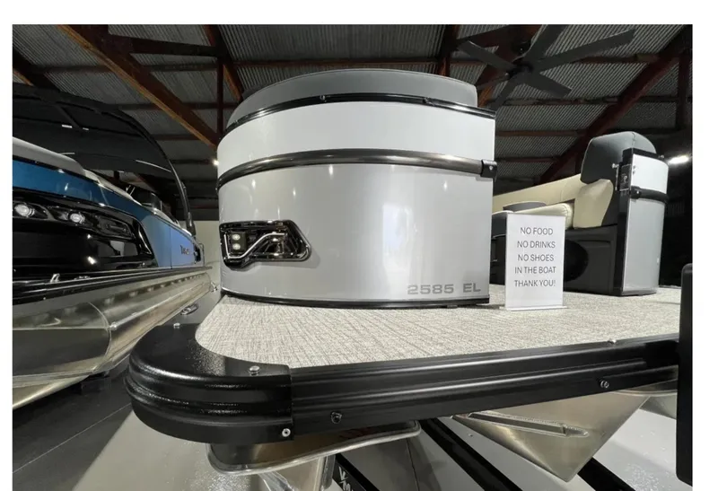 Slide: The Image of 2025 Tahoe CASCADE boat interior with seating and a "No Food, No Drinks, No Shoes" sign. - 6