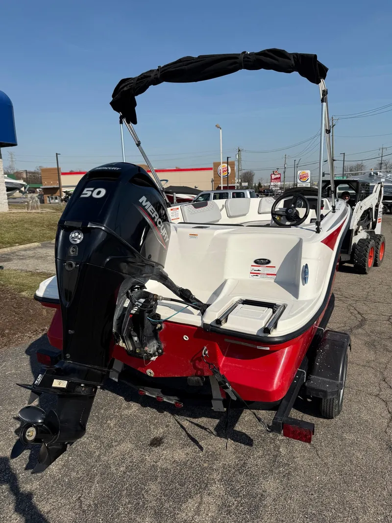 Slide: The Image of 2022 Bayliner Element M15 boat with Mercury 50 engine, parked on a trailer. - 9