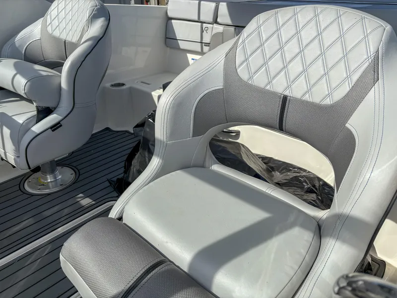 Slide: The Image of 2021 Bayliner VR4 boat interior with stylish, cushioned seats and modern design. - 10