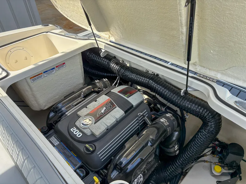 Slide: The Image of 2021 Bayliner VR4 boat engine compartment with 200 horsepower motor. - 7