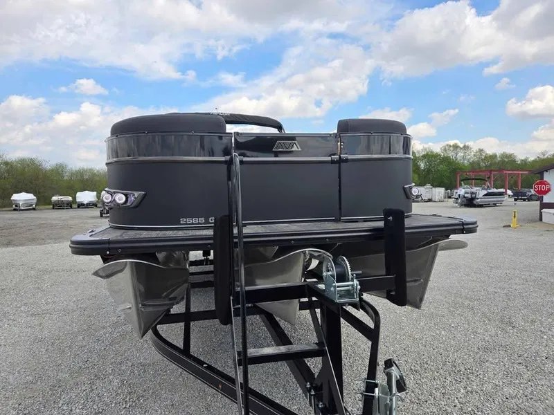 Slide: The Image of 2025 Avalon Catalina Quad Lounge Shift pontoon boat on trailer, parked outdoors. - 3