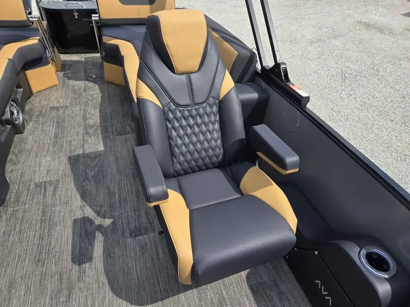 Slide: The Image of 2025 Avalon Catalina Quad Lounge Shift boat seat with luxurious black and tan upholstery. - 7