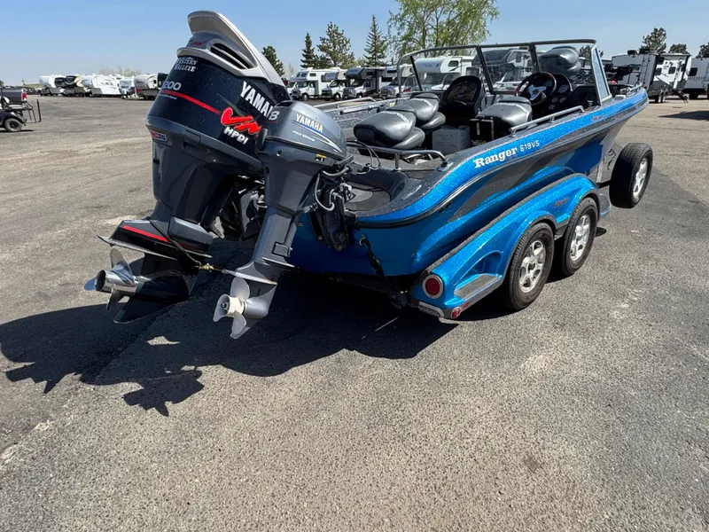 Slide: The Image of 2004 Ranger 619 VS Fisherman boat with Yamaha outboard motor on a trailer. - 4
