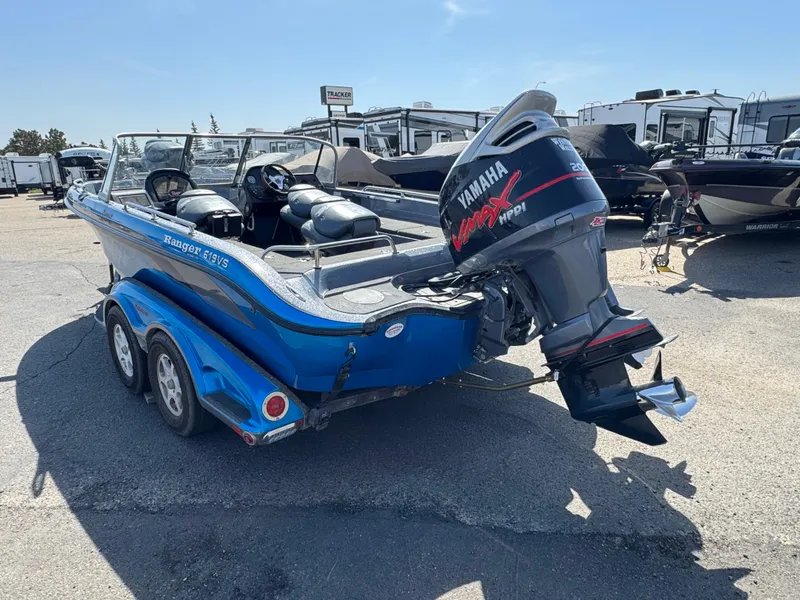 Slide: The Image of 2004 Ranger 619 VS Fisherman boat with Yamaha outboard motor, parked on a trailer. - 5