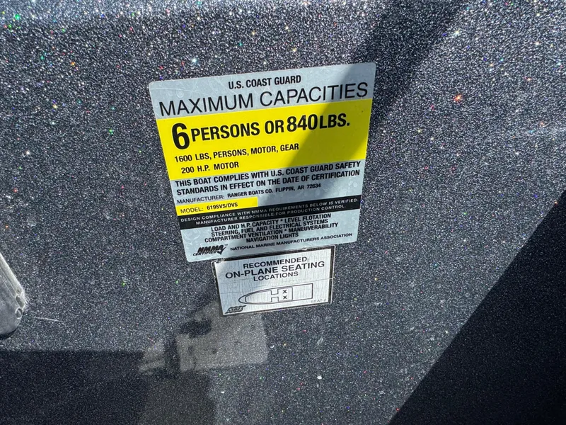 Slide: The Image of U.S. Coast Guard capacity label on 2004 Ranger 619 VS Fisherman boat, 6 persons or 840 lbs. - 8