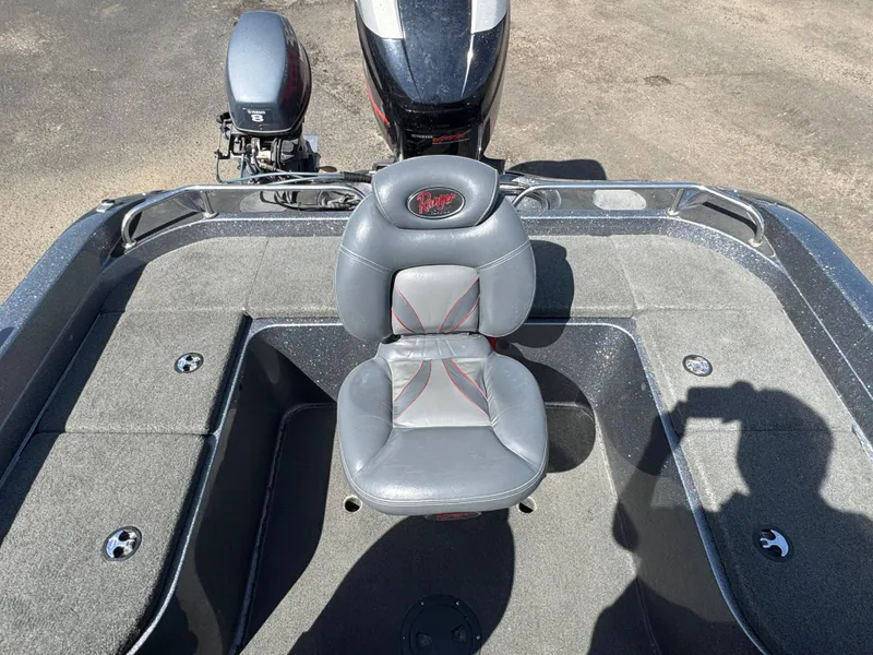 Slide: The Image of 2004 Ranger 619 VS Fisherman boat with gray seating and motor, viewed from above. - 9