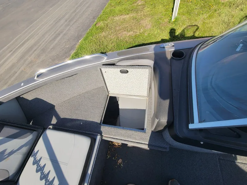 Slide: The Image of 2018 Crestliner 1950 Sportfish SST boat with open storage compartment on deck. - 11