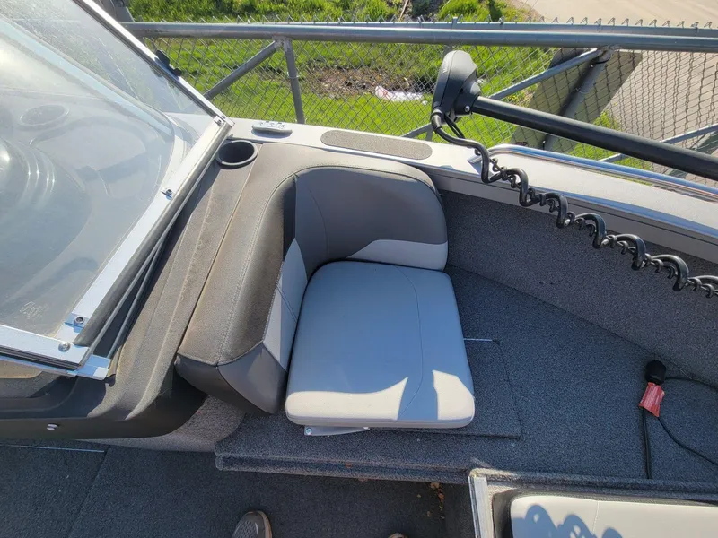 Slide: The Image of 2018 Crestliner 1950 Sportfish SST boat interior with seating and windshield. - 12