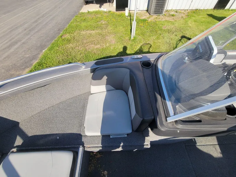 Slide: The Image of 2018 Crestliner 1950 Sportfish SST boat interior with seating and windshield. - 13