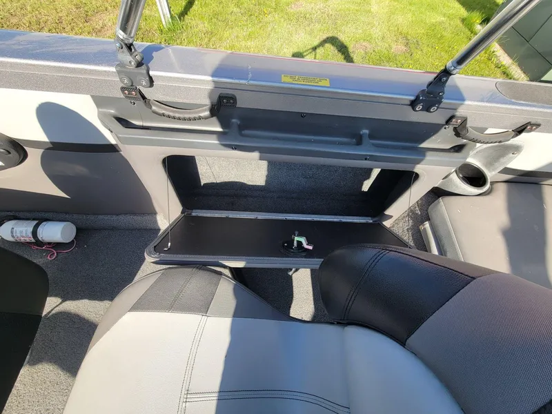 Slide: The Image of 2018 Crestliner 1950 Sportfish SST interior with open storage compartment and seating. - 18