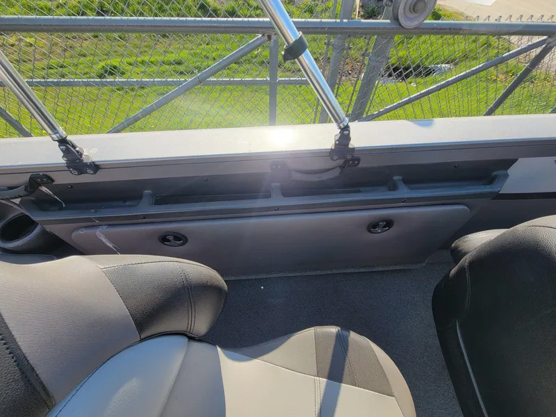 Slide: The Image of Interior of 2018 Crestliner 1950 Sportfish SST boat, featuring seating and storage compartments. - 19