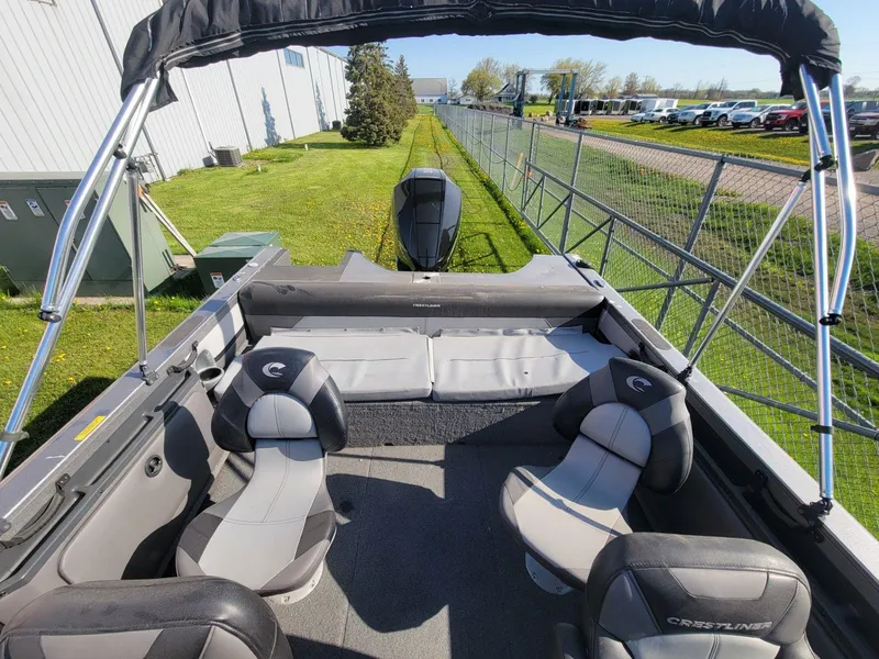 Slide: The Image of 2018 Crestliner 1950 Sportfish SST boat interior with seating and canopy. - 24