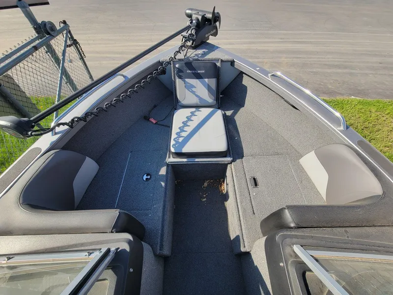 Slide: The Image of 2018 Crestliner 1950 Sportfish SST boat interior with seating and trolling motor. - 9