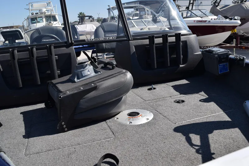Slide: The Image of 2024 Tracker Pro Guide V-16 WT boat interior with seating and storage compartments. - 3