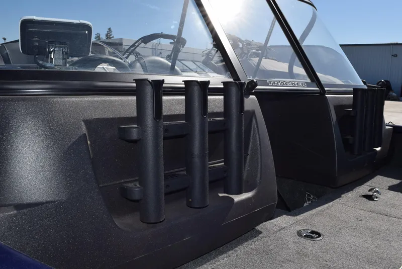 Slide: The Image of 2024 Tracker Pro Guide V-16 WT boat interior with rod holders and windshield. - 5