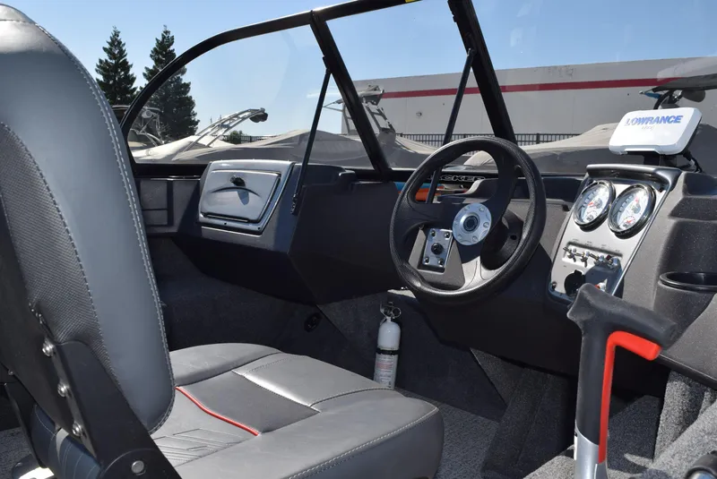 Slide: The Image of 2024 Tracker Pro Guide V-16 WT boat interior with steering wheel and dashboard controls. - 6