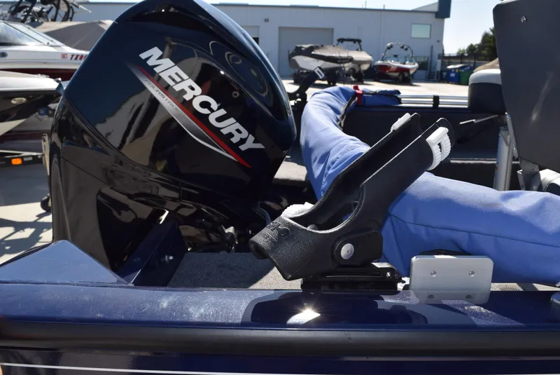 Slide: The Image of 2024 Tracker Pro Guide V-16 WT boat with Mercury engine, featuring rod holder. - 8