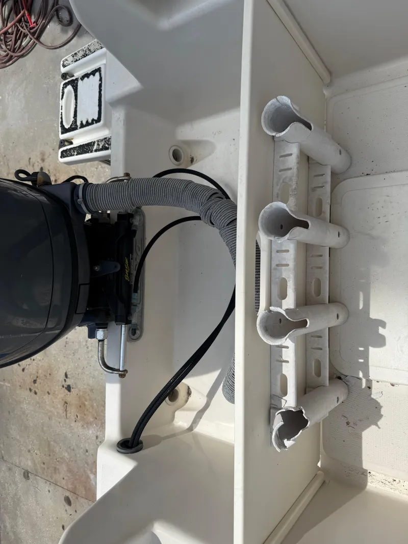 Slide: The Image of 2008 Cobia 194 Center Console boat with motor and rod holders. - 11