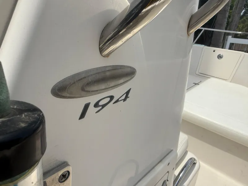 Slide: The Image of 2008 Cobia 194 Center Console boat interior with model emblem. - 16