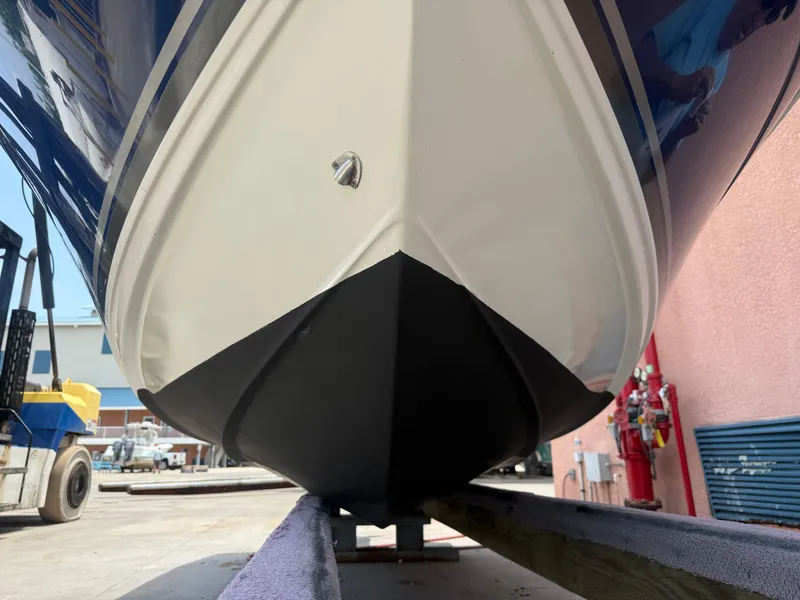 Slide: The Image of 2008 Cobia 194 Center Console boat hull on trailer, close-up view. - 2