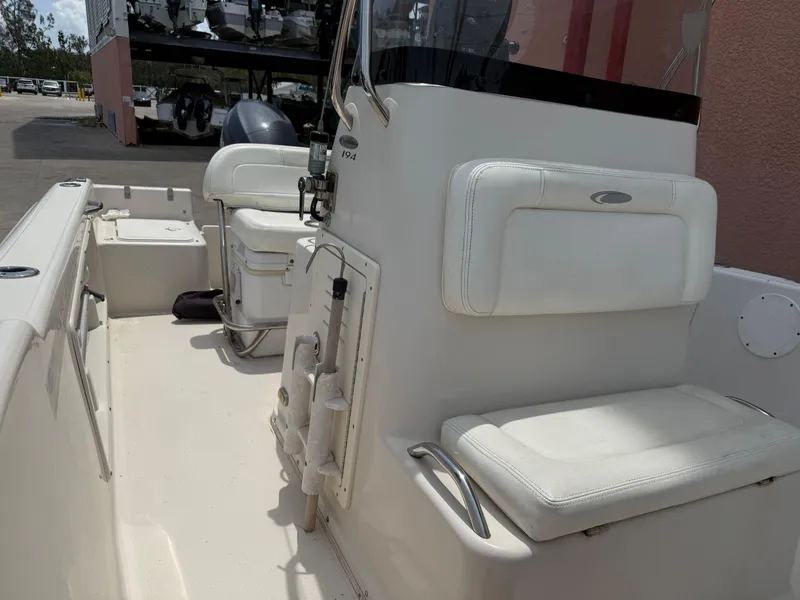 Slide: The Image of 2008 Cobia 194 Center Console boat interior with white seating and console. - 23