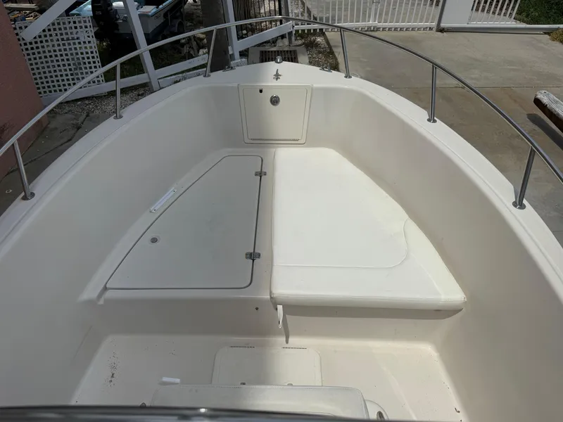 Slide: The Image of 2008 Cobia 194 Center Console boat interior with seating and storage compartments. - 26