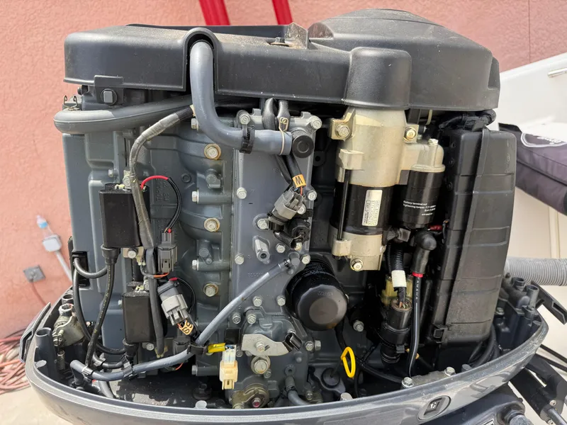Slide: The Image of 2008 Cobia 194 Center Console boat engine, detailed view of mechanical components. - 27