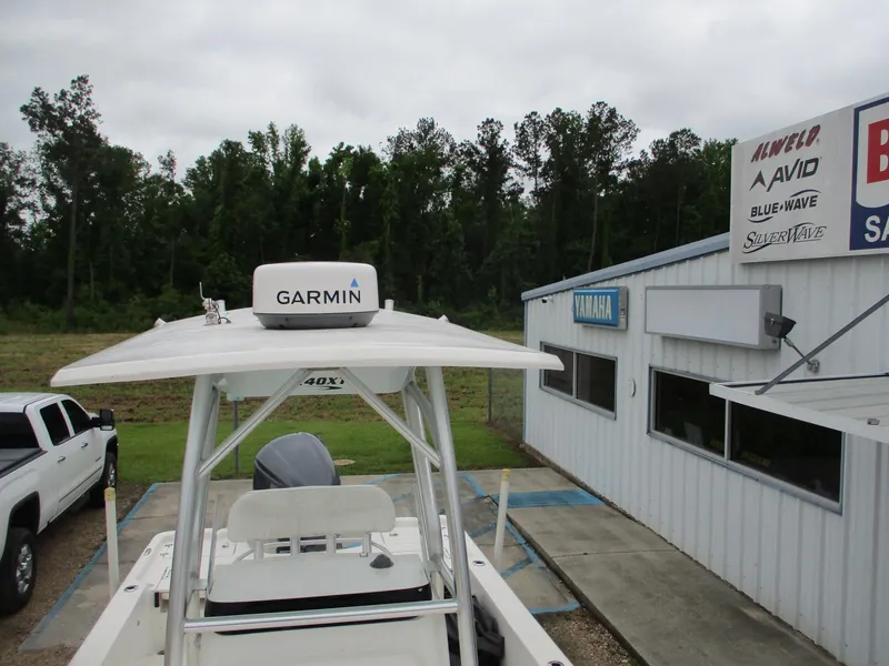 Slide: The Image of 2013 Sea Fox 240 Viper boat with Garmin equipment near dealership building. - 12