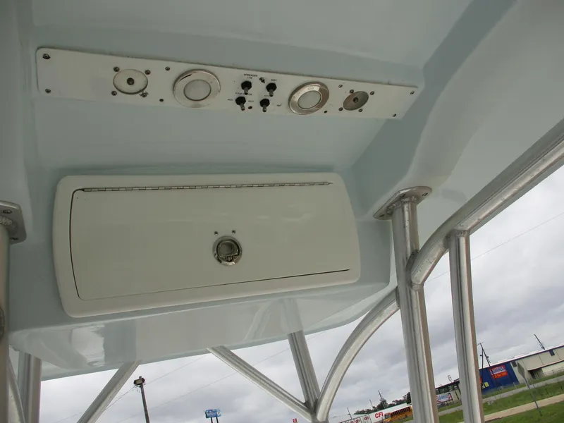 Slide: The Image of 2013 Sea Fox 240 Viper boat console with controls and storage compartment. - 14