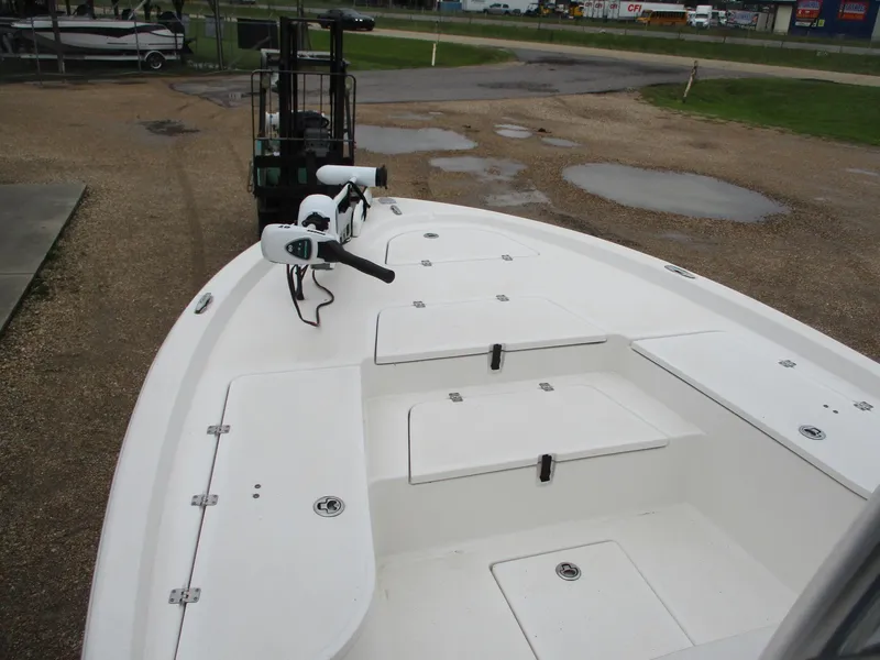 Slide: The Image of 2013 Sea Fox 240 Viper boat deck with storage compartments and trolling motor. - 4