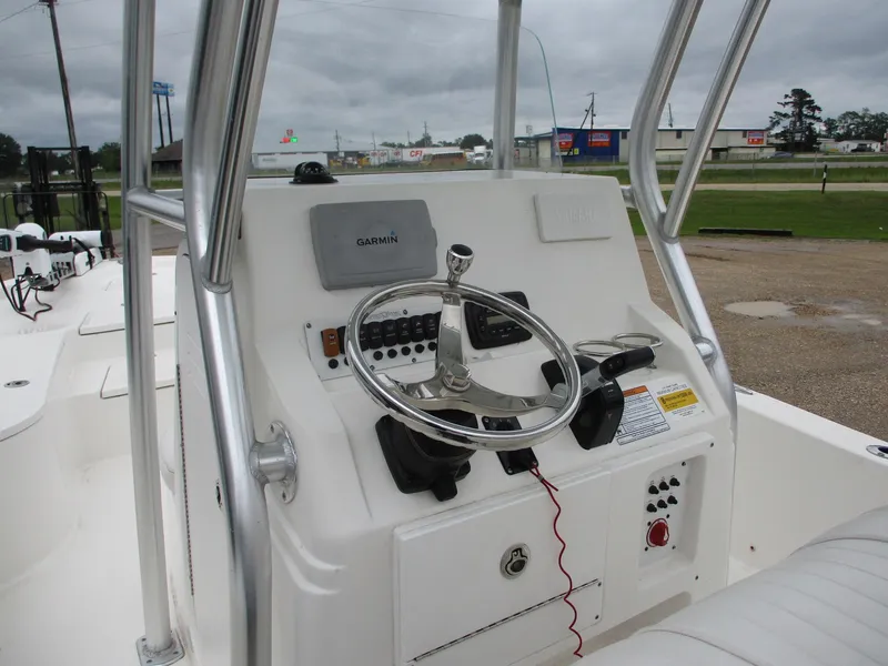 Slide: The Image of 2013 Sea Fox 240 Viper boat console with steering wheel and Garmin navigation system. - 6