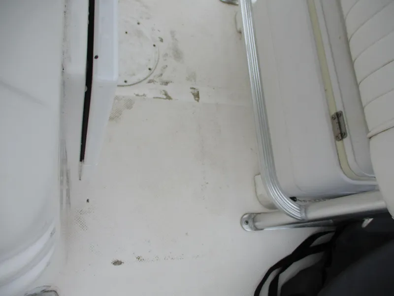 Slide: The Image of Interior view of a 2013 Sea Fox 240 Viper boat, showing seating and flooring details. - 9