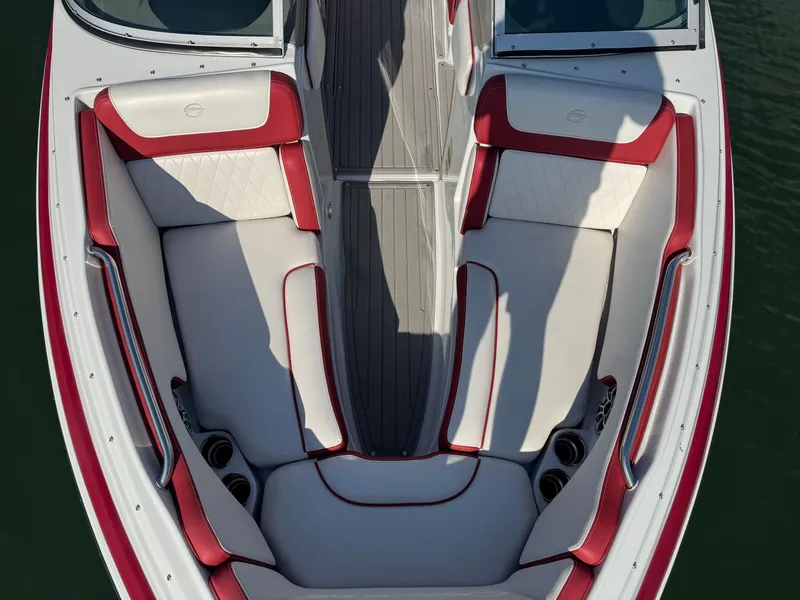 Slide: The Image of 2018 Crownline 225SS boat interior with red and white seating, overhead view. - 10