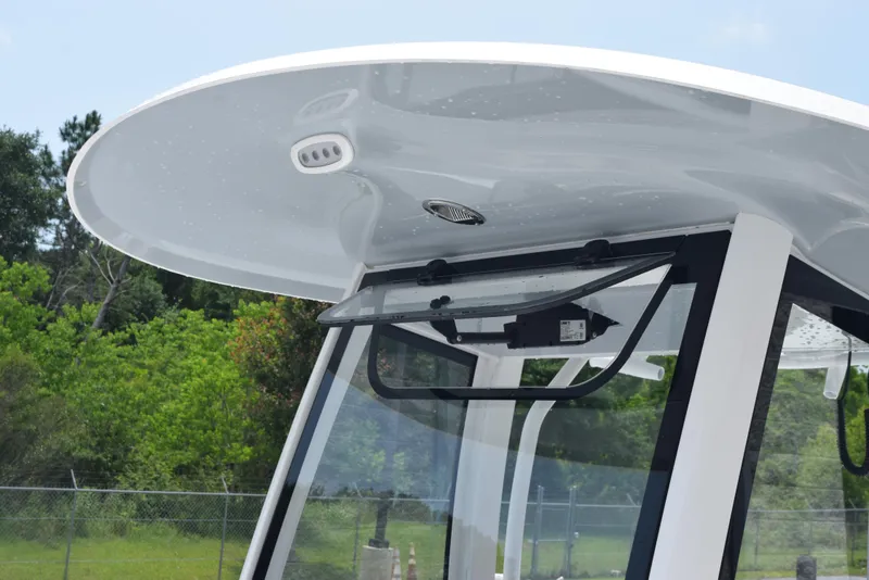 Slide: The Image of 2025 Sea Hunt Ultra 275 SE boat's T-top and windshield detail. - 13