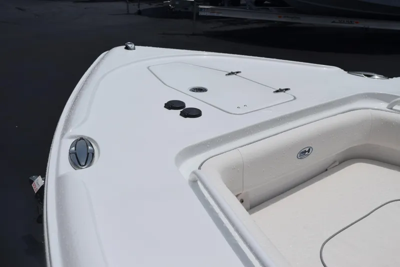 Slide: The Image of Bow of 2025 Sea Hunt Ultra 275 SE boat, featuring sleek white design. - 15
