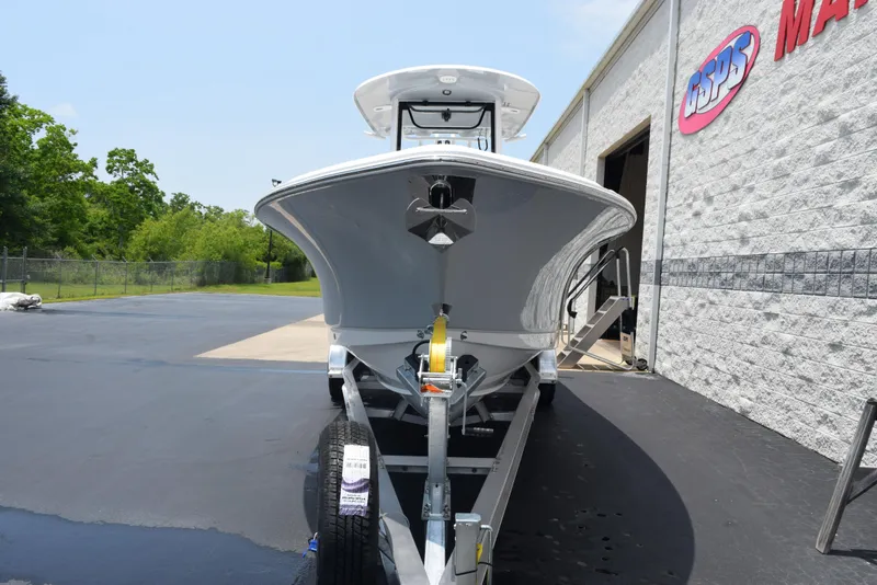Slide: The Image of 2025 Sea Hunt Ultra 275 SE boat on trailer outside a marine dealership. - 3