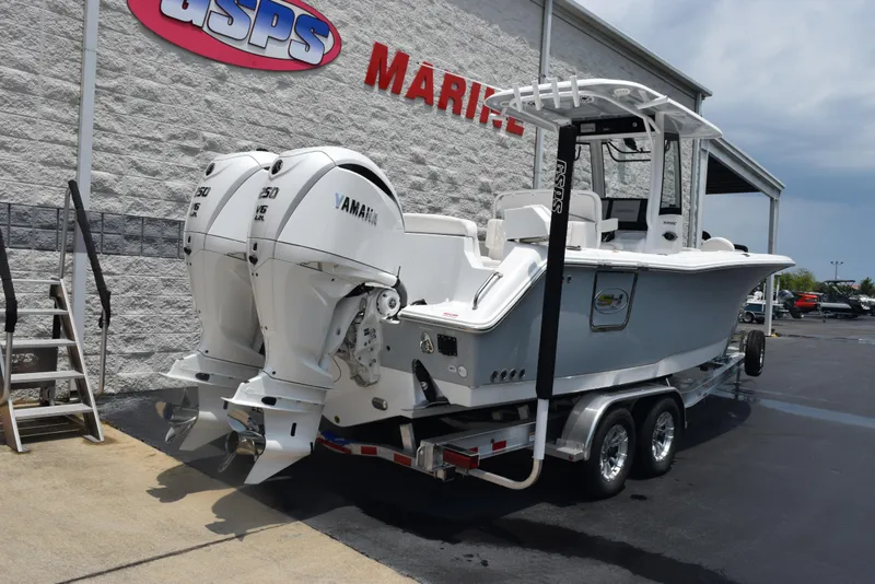 Slide: The Image of 2025 Sea Hunt Ultra 275 SE boat on trailer at dealership. - 4