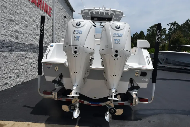 Slide: The Image of 2025 Sea Hunt Ultra 275 SE with twin 250 V6 engines, rear view. - 5