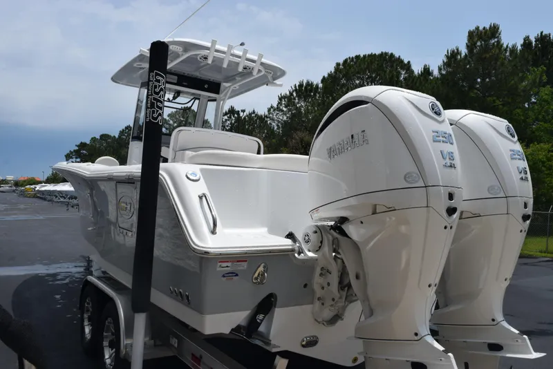 Slide: The Image of 2025 Sea Hunt Ultra 275 SE boat with dual engines on a trailer. - 6