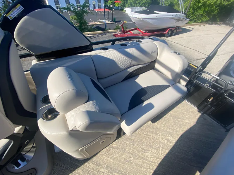 Slide: The Image of 2023 JC Sporttoon 26TT boat interior with plush seating and modern design. - 10