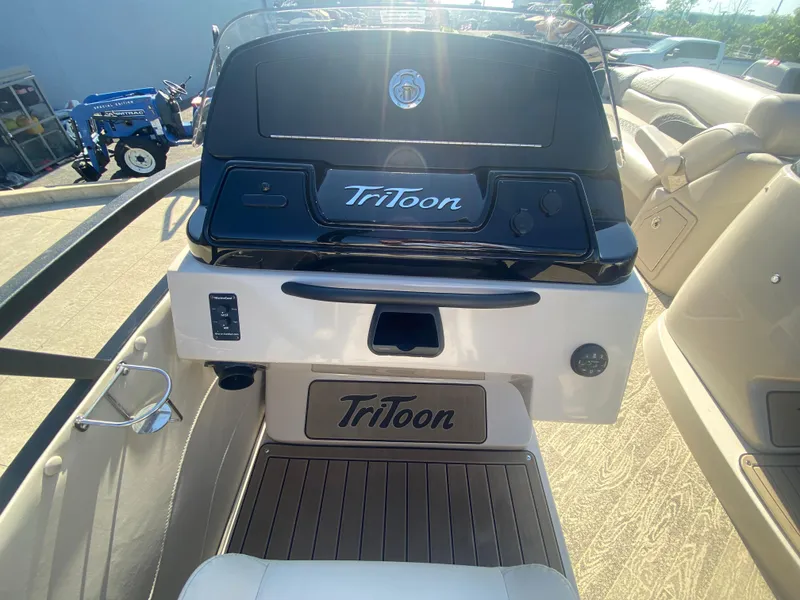Slide: The Image of 2023 JC Sporttoon 26TT boat interior with Tritoon branding and seating. - 13