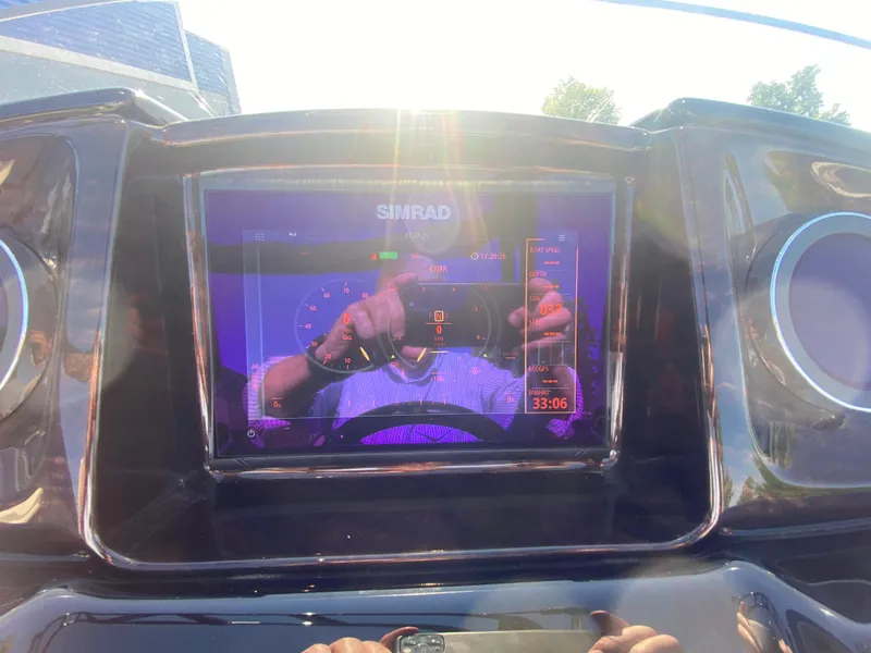 Slide: The Image of Dashboard of 2023 JC Sporttoon 26TT with Simrad display in sunlight. - 18