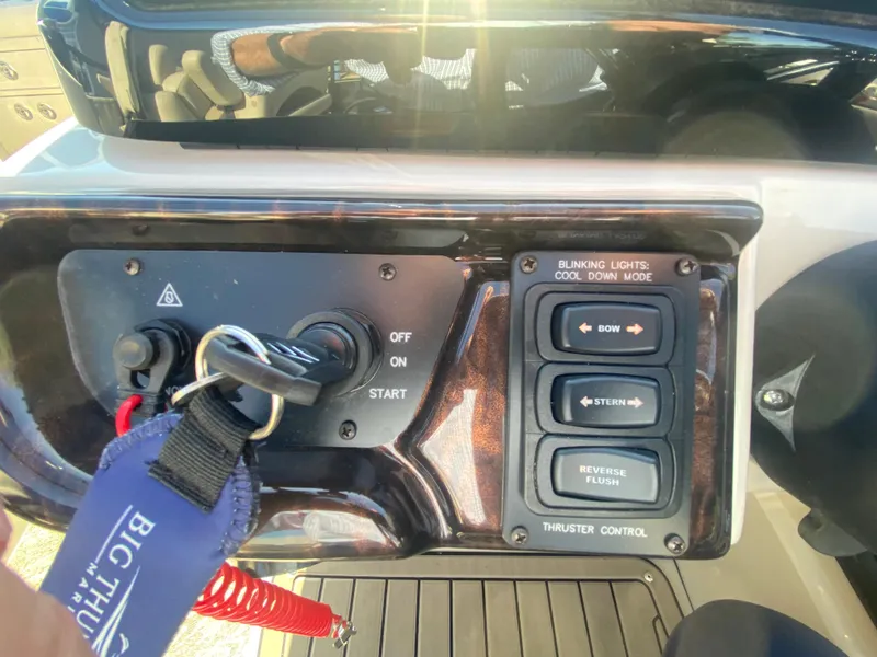 Slide: The Image of Control panel of 2023 JC Sporttoon 26TT boat with ignition and thruster controls. - 22