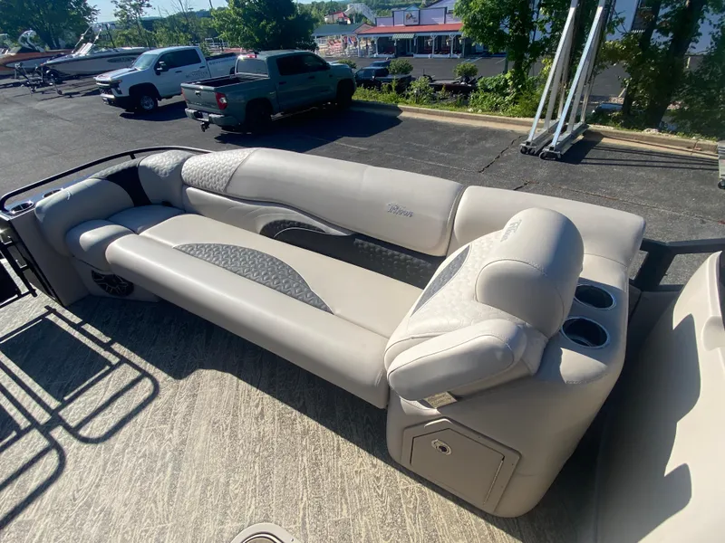 Slide: The Image of 2023 JC Sporttoon 26TT pontoon boat with luxurious seating and cup holders. - 25