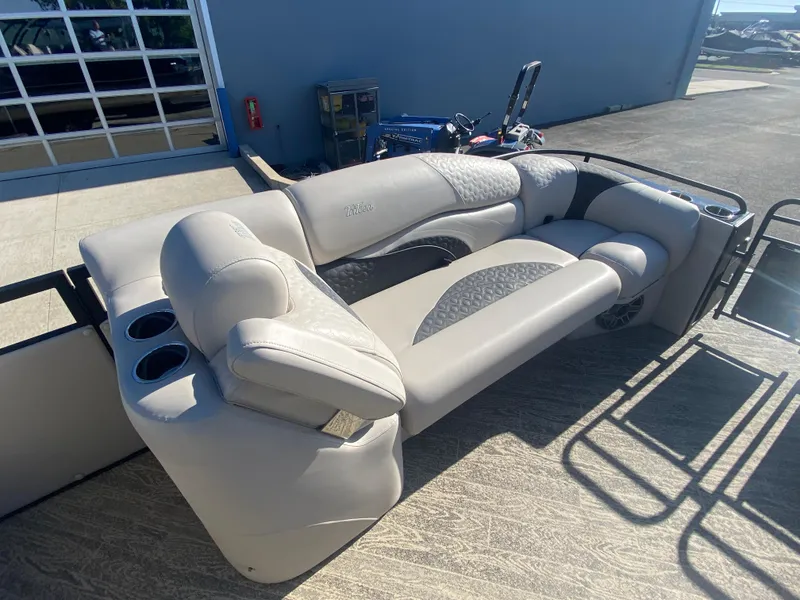 Slide: The Image of 2023 JC Sporttoon 26TT boat seating with cup holders, featuring modern design and comfortable upholstery. - 26