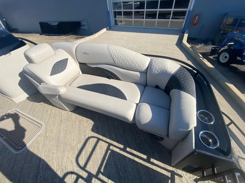 Slide: The Image of 2023 JC Sporttoon 26TT boat interior with luxurious seating and cup holders. - 27