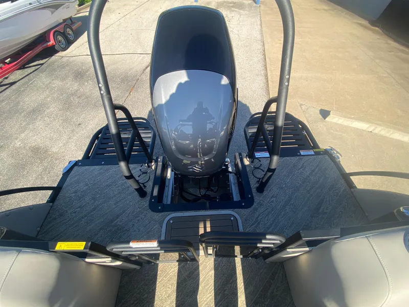 Slide: The Image of 2023 JC Sporttoon 26TT boat deck with motor and seating area. - 35