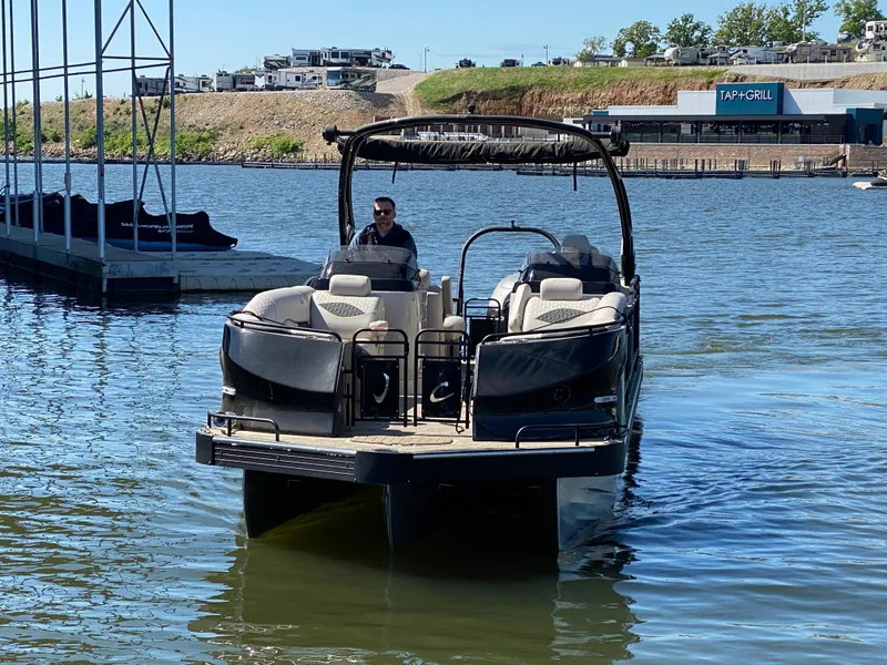 Slide: The Image of 2023 JC Sporttoon 26TT pontoon boat on a sunny lake. - 38