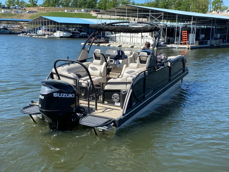 Slide: The Image of 2023 JC Sporttoon 26TT pontoon boat on water, featuring Suzuki outboard motor. - 41