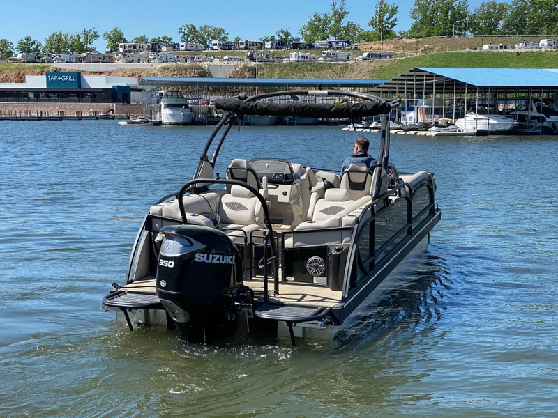 Slide: The Image of 2023 JC Sporttoon 26TT pontoon boat with Suzuki engine on a sunny lake. - 42